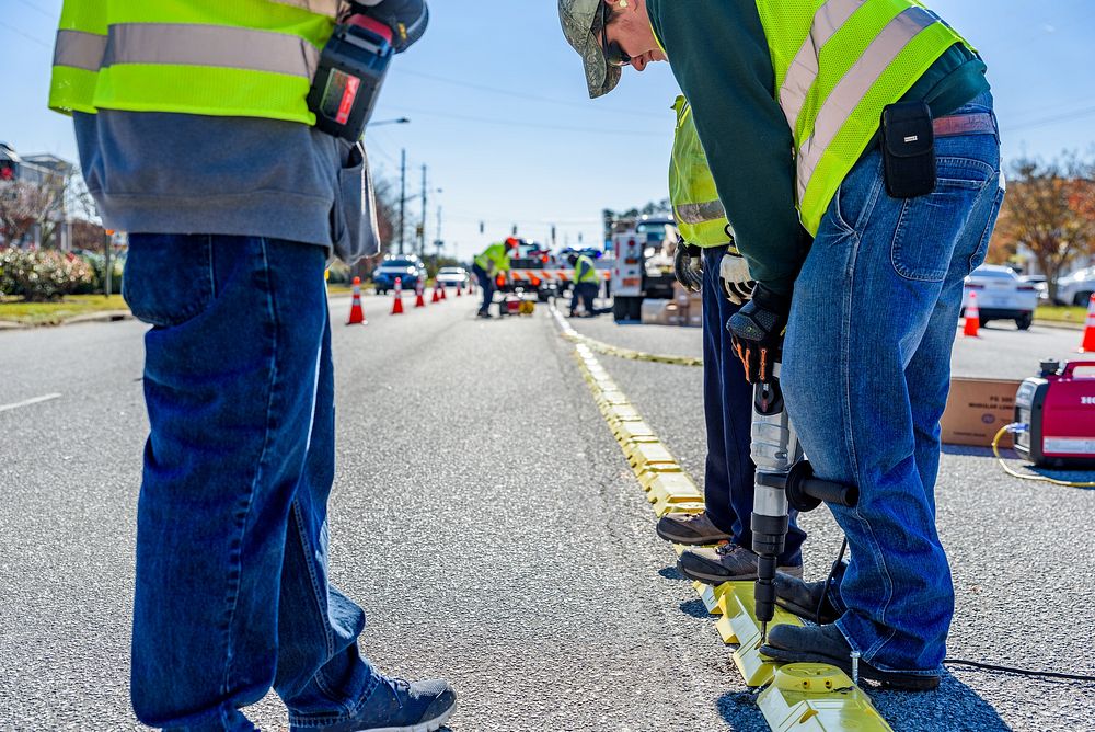 Traffic delineator installation at Charles Blvd and Smythewick Dr, part of the City's effort to improve traffic safety.…