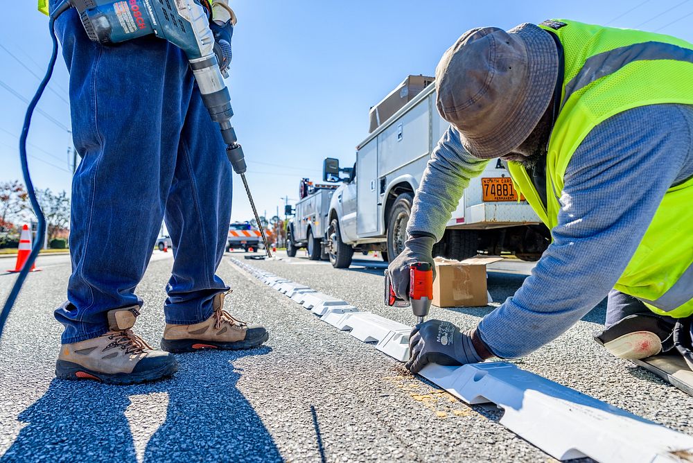 Traffic delineator installation at Charles Blvd and Smythewick Dr, part of the City's effort to improve traffic safety.…