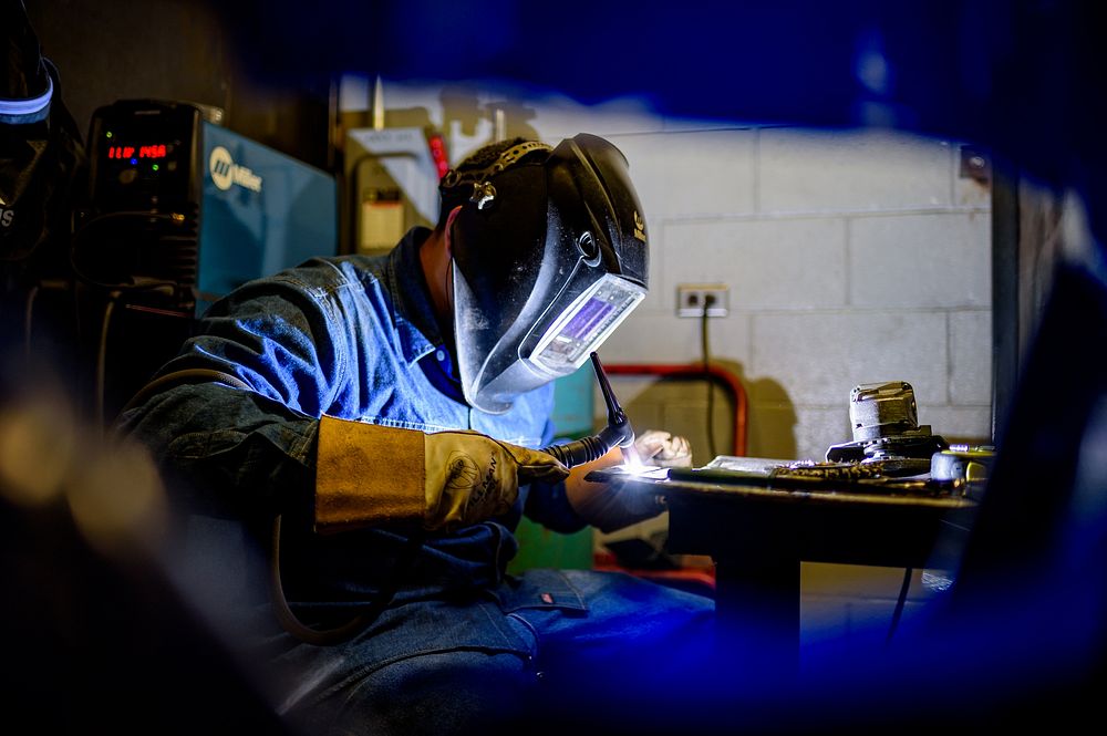 A Pitt Community College Workforce Development student practices GTAW (TIG) welding, Greenville, date unknown, photo by…