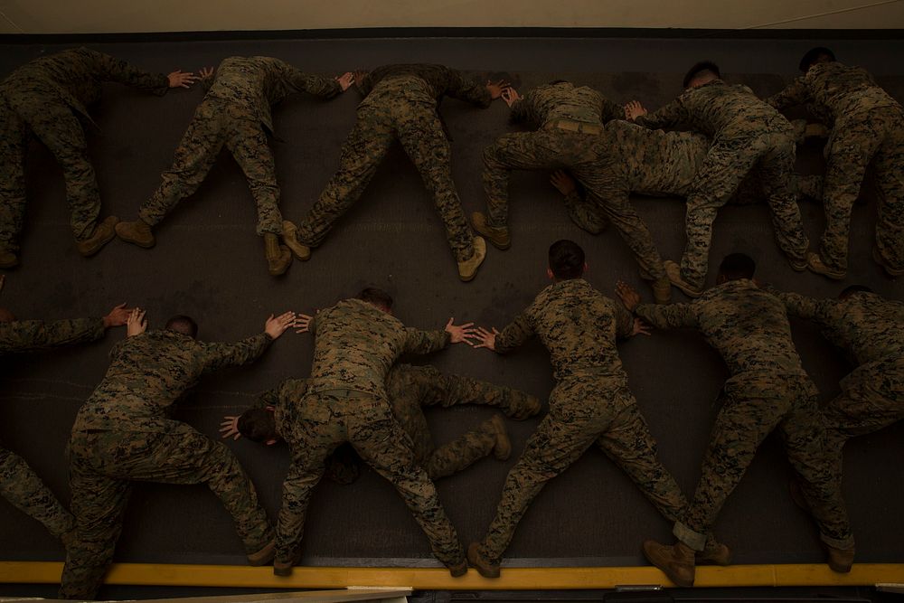 U.S. Marines with the 13th Marine Expeditionary Unit (MEU), exercise during a Marine Corps Martial Arts Program course…