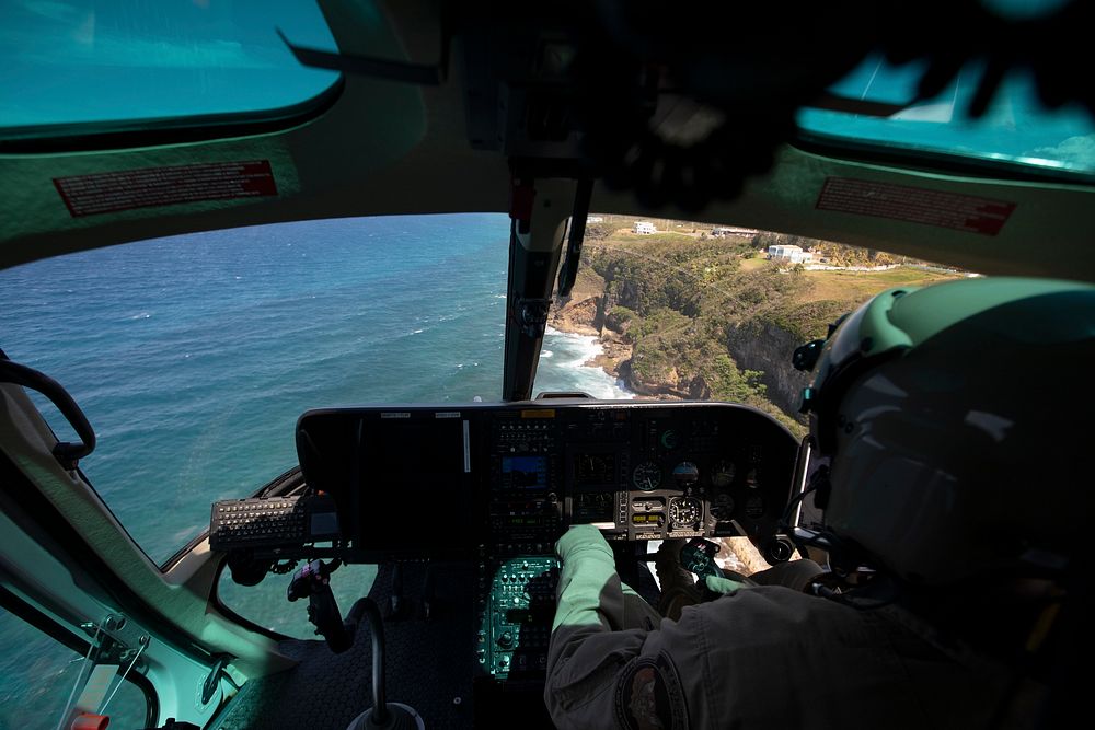 The shores of Puerto Rico are seen through the cockpit window of a U.S. Customs and Border Protection Air and Marine…