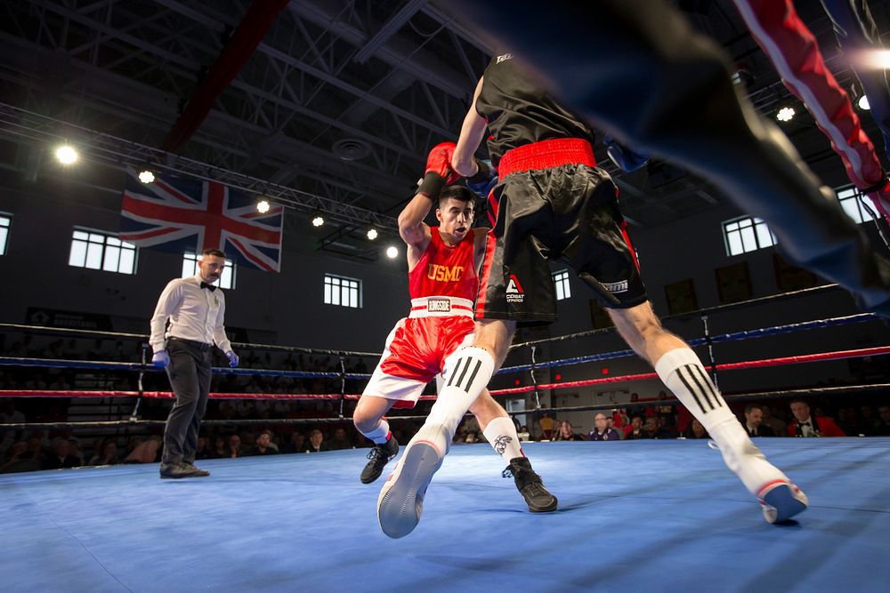 U.S. Marines and British Royal Marines compete in a boxing match during the Royal Marines Sports Association Tour at Barber…