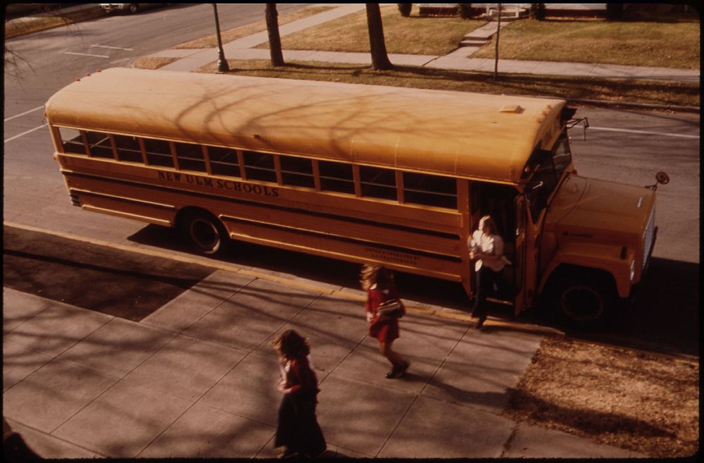 Students Arriving by Schoolbus at Cathedral Senior High School in New Ulm, Minnesota.