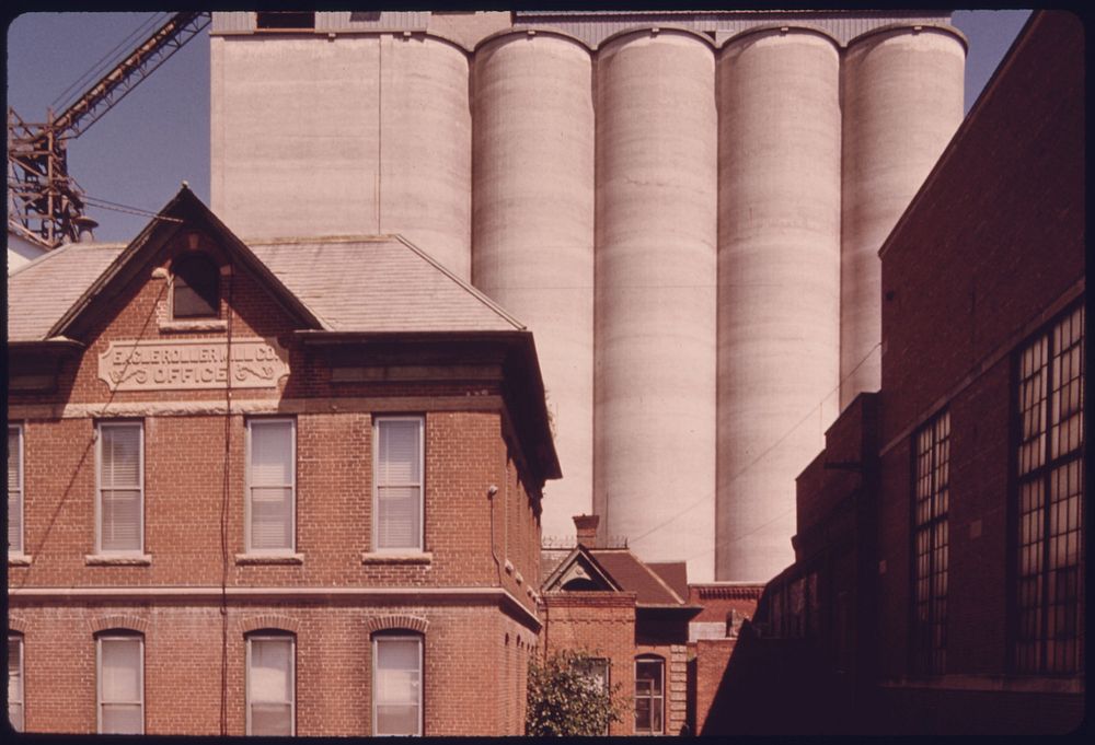 The Old Eagle Roller Mill Office, Foreground, and Grain Storage for Burdick Elevator in the Background at New Ulm Minnesota.