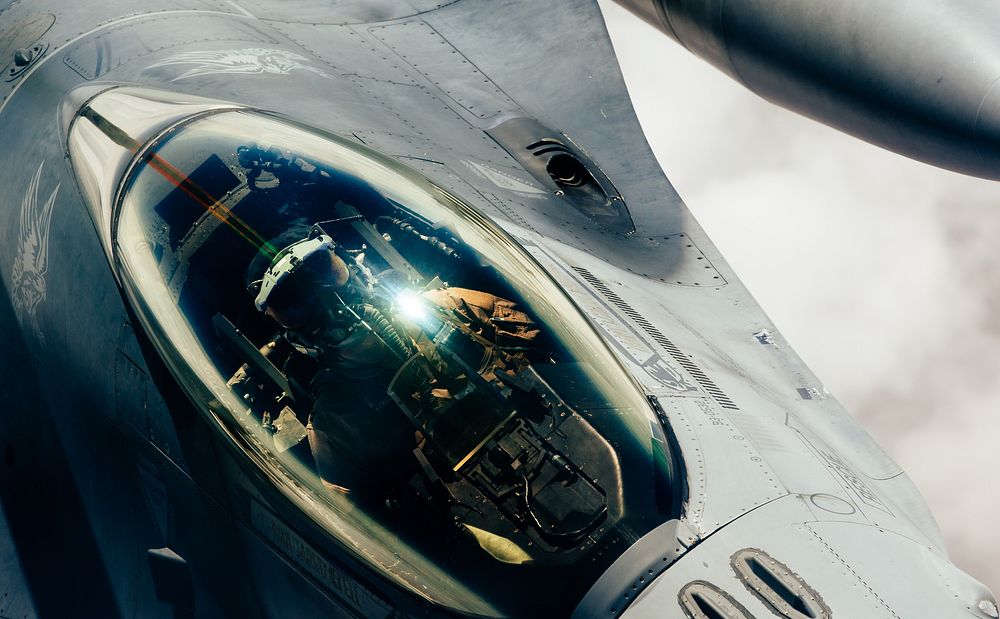 A U.S. Air Force F-16 Fighting Falcon approaches a 908th Expeditionary Aerial Refueling Squadron KC-10 Extender for fuel…