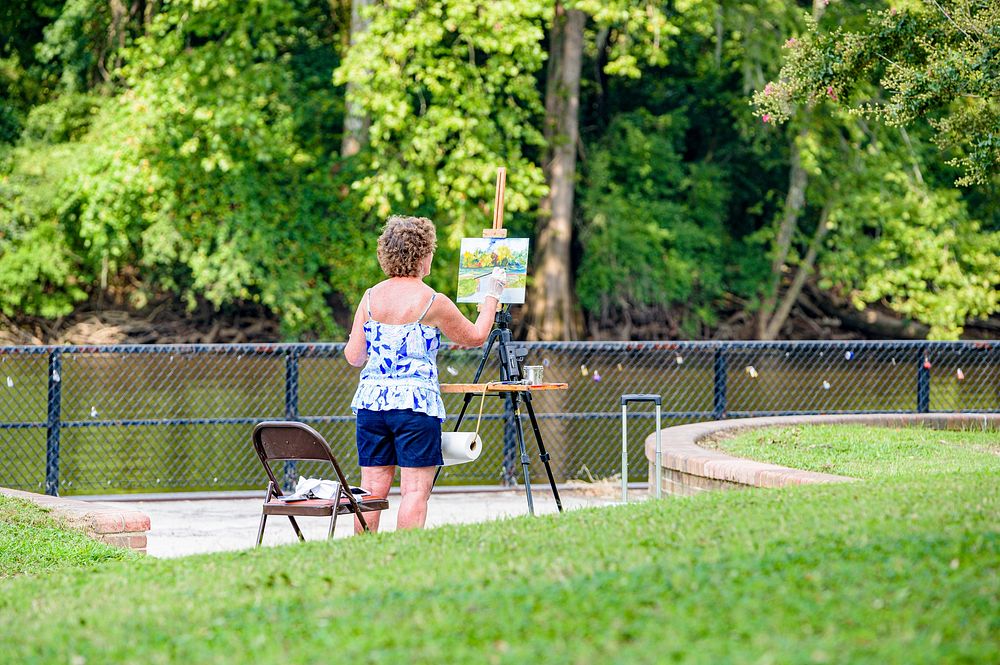 Woman painting in the park, Greenville, date unknown.  Original public domain image from Flickr