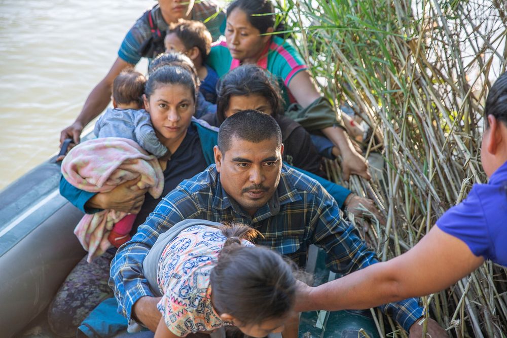 Migrants illegally enter the U.S. by crossing the Rio Grande in rubber boats near Los Ebanos, Texas, June 15, 2019.