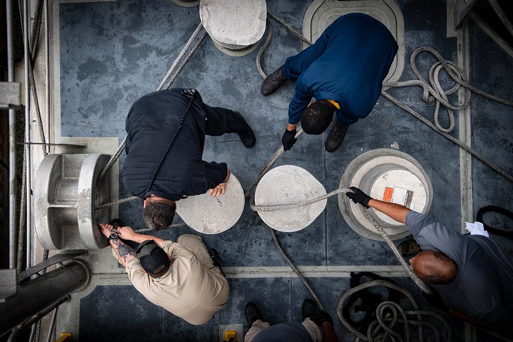 U.S. Navy Civil Service mariners assigned to the Spearhead-class expeditionary fast transport ship USNS Carson City (T-EPF…