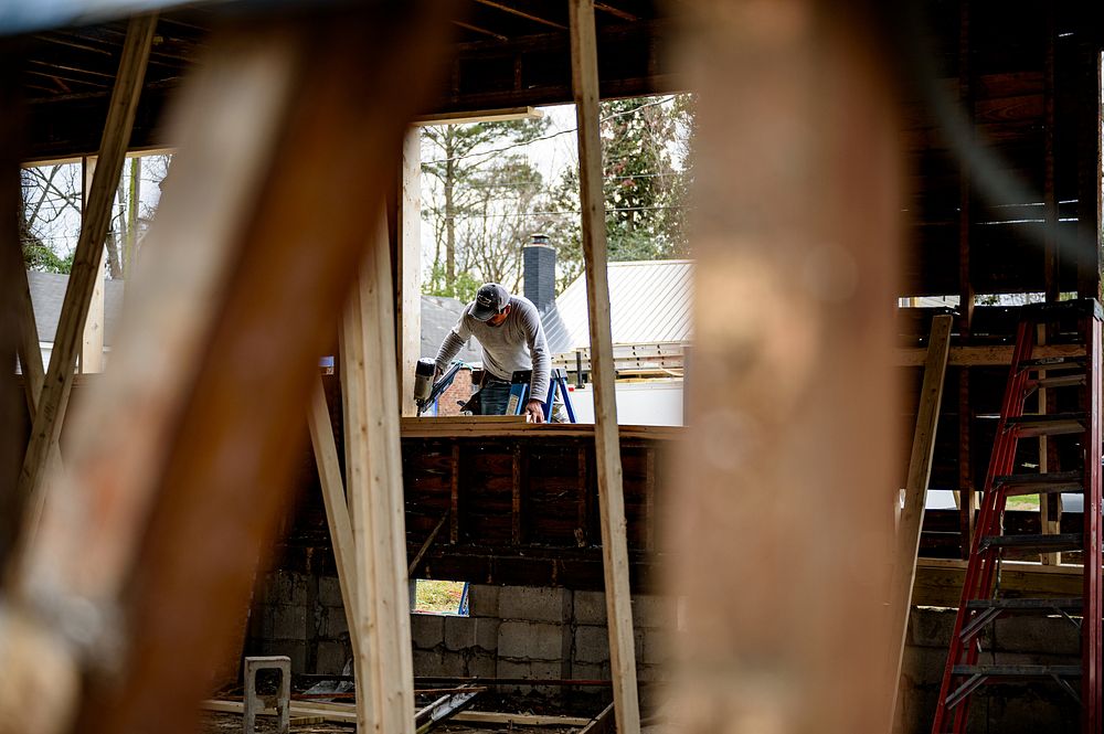 Housing RehabilitationContractors add new framing to a house undergoing rehabilitation in the Lincoln Park neighborhood of…