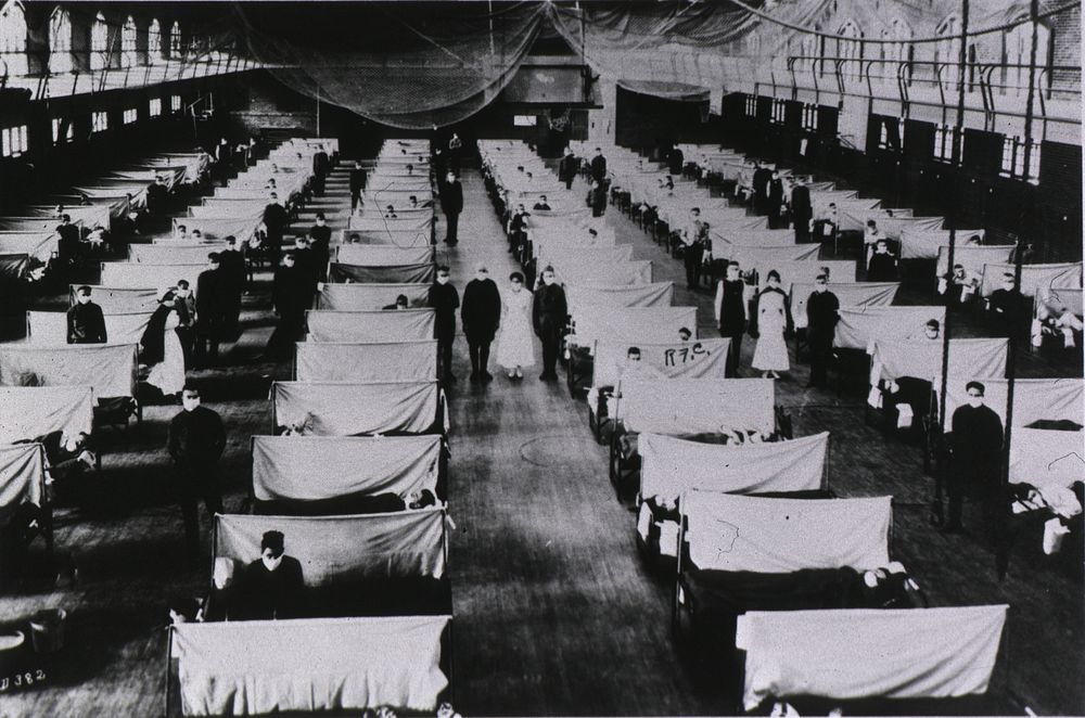 Quarantine Ward. Overhead view of a special ward. The patients' beds are separated by screens. Everyone wears a mask. Nets…