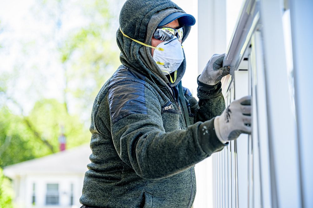 Finishing touches are applied to the exterior of a home undergoing rehabilitation through the City of Greenville's Housing…