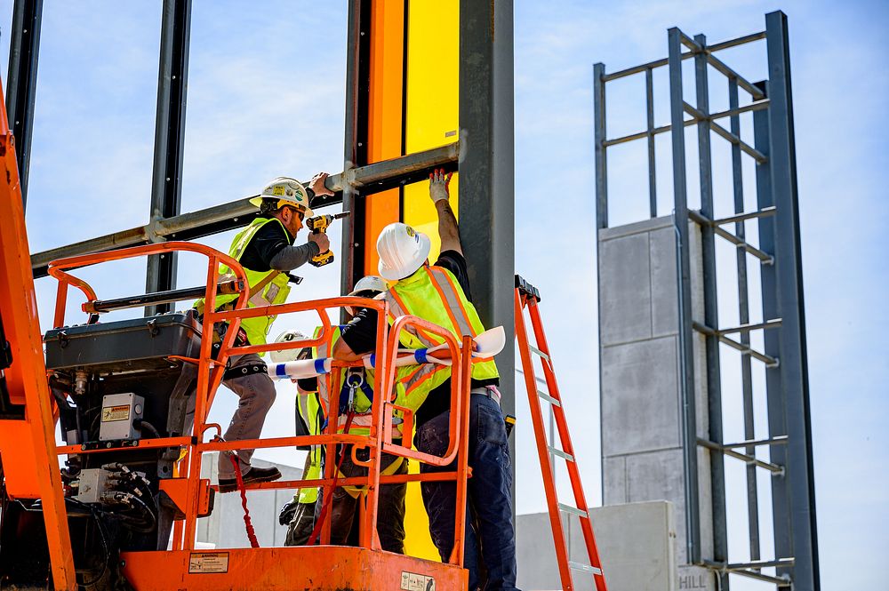 Glass panels are installed as construction progresses at Sycamore Hill Gateway Plaza, April 22, 2020.