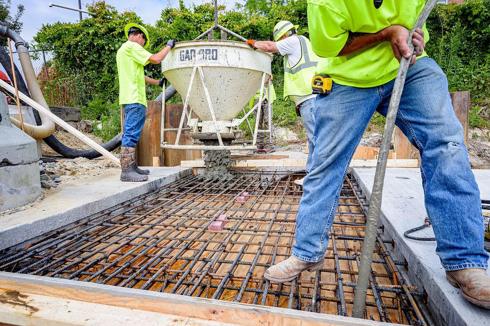 Engineers inspect a portion of the new culvert as the last two sections of the culvert between Reade Circle and 8th Street…