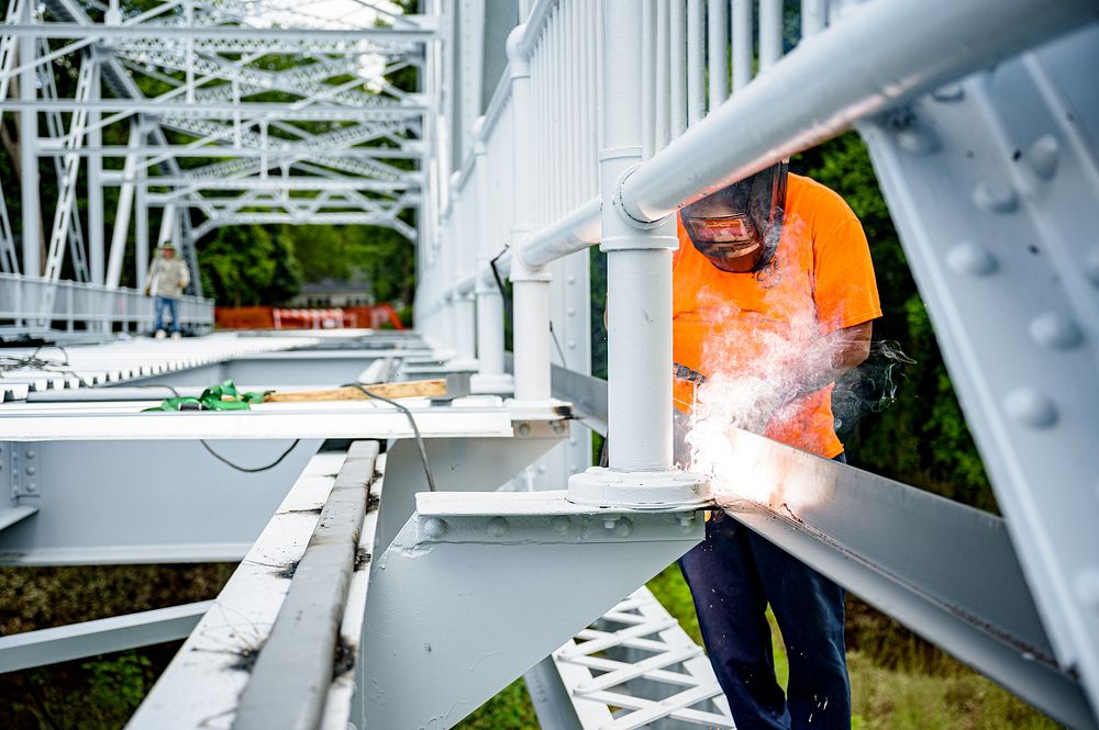 Work to upgrade and improve the Town Common Greenway Pedestrian Bridge continues, June 29, 2020. Original public domain…