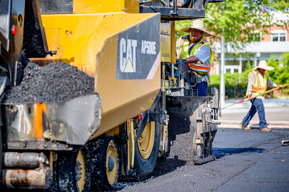 Construction crews lay down new layers of asphalt along Reade Circle as the work near the Evans Street intersection nears…