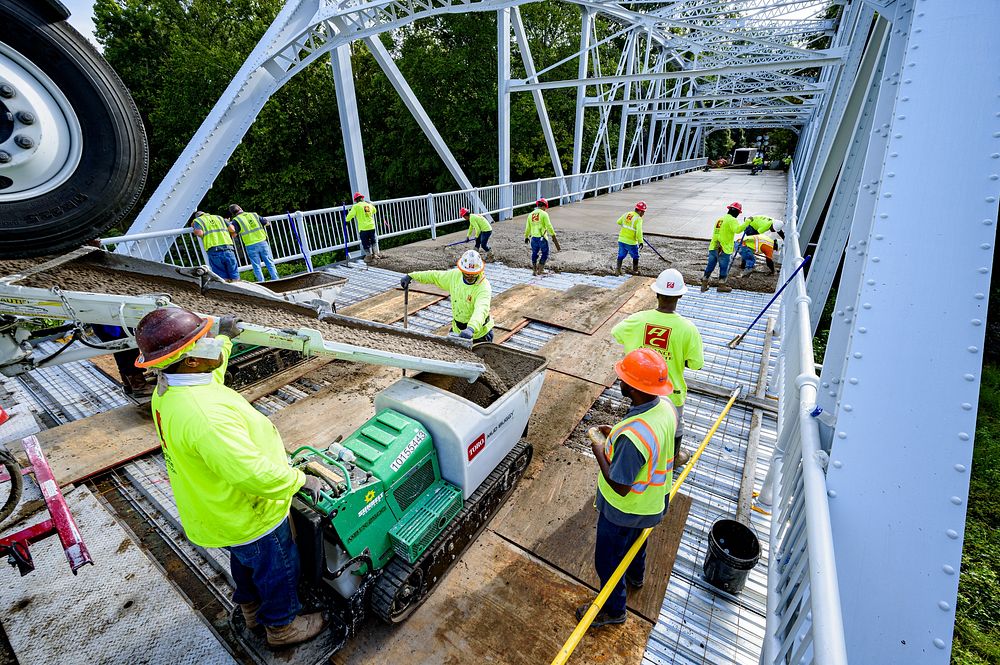 Concrete decking is the final piece of the Town Common greenway bridge renovations, August 21. Original public domain image…