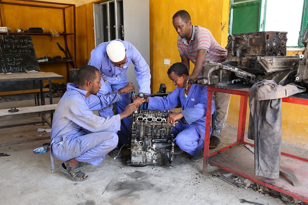 Somalian mechanics working. Original public domain image from Flickr