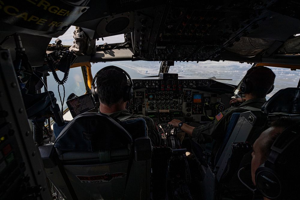 A U.S. Air Force KC-135R Stratotanker piloted by Lt. Col. Christian Lawlor, left, and Lt. Col. Tom Cervini flies towards the…