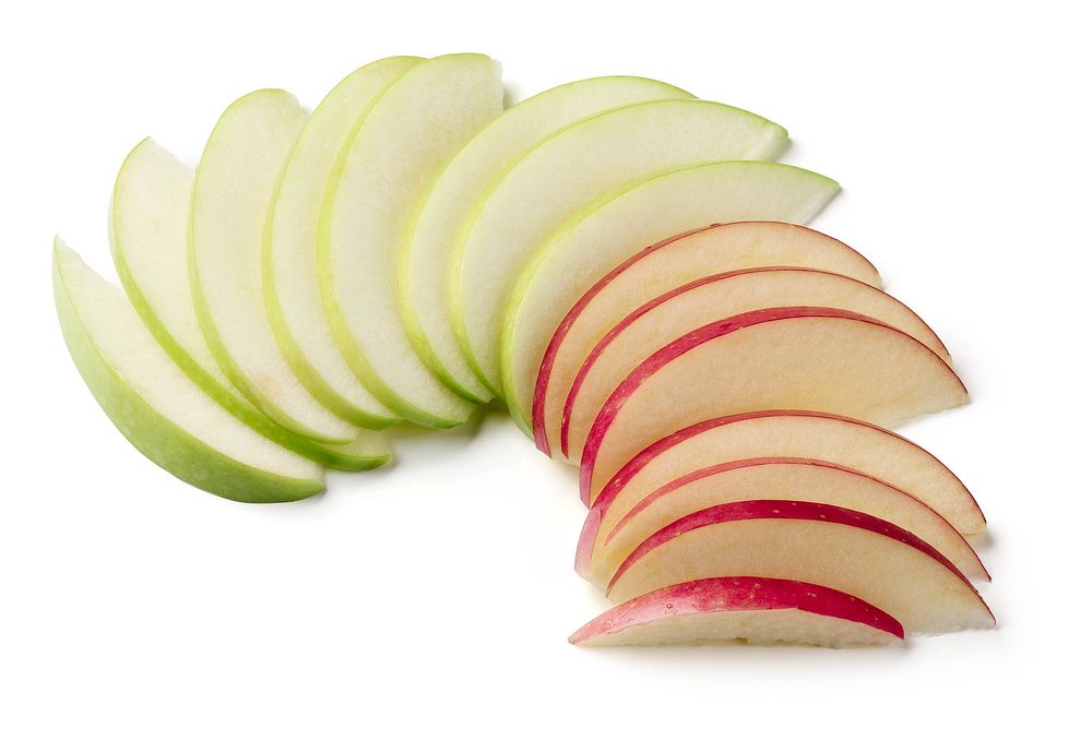 Green and red apple slices on white background. Original public domain image from Flickr
