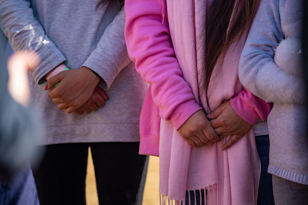 People standing, hands clasped. Original public domain image from Flickr