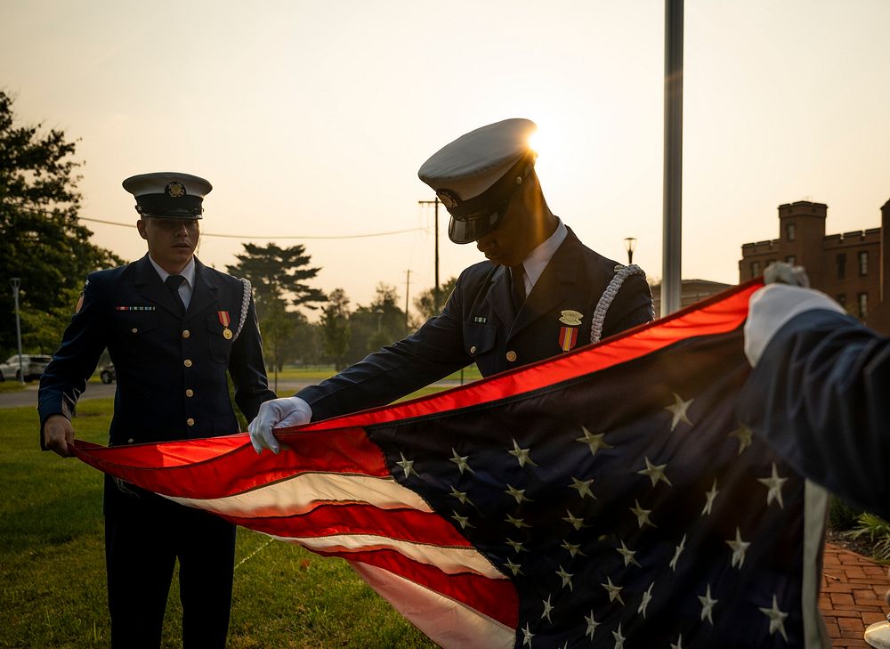 Members of the United States Coast Guard Ceremonial Honor Guard prepare for a flag raising ceremony at the Department of…