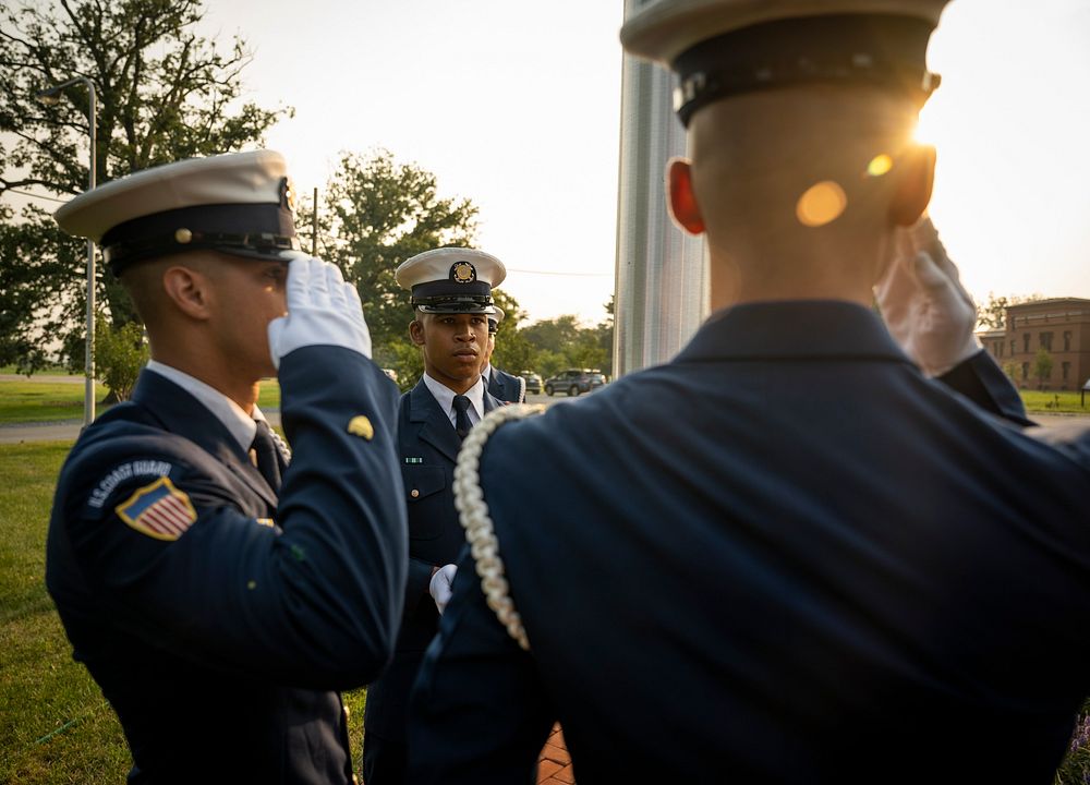 Members of the United States Coast Guard Ceremonial Honor Guard prepare for a flag raising ceremony at the Department of…