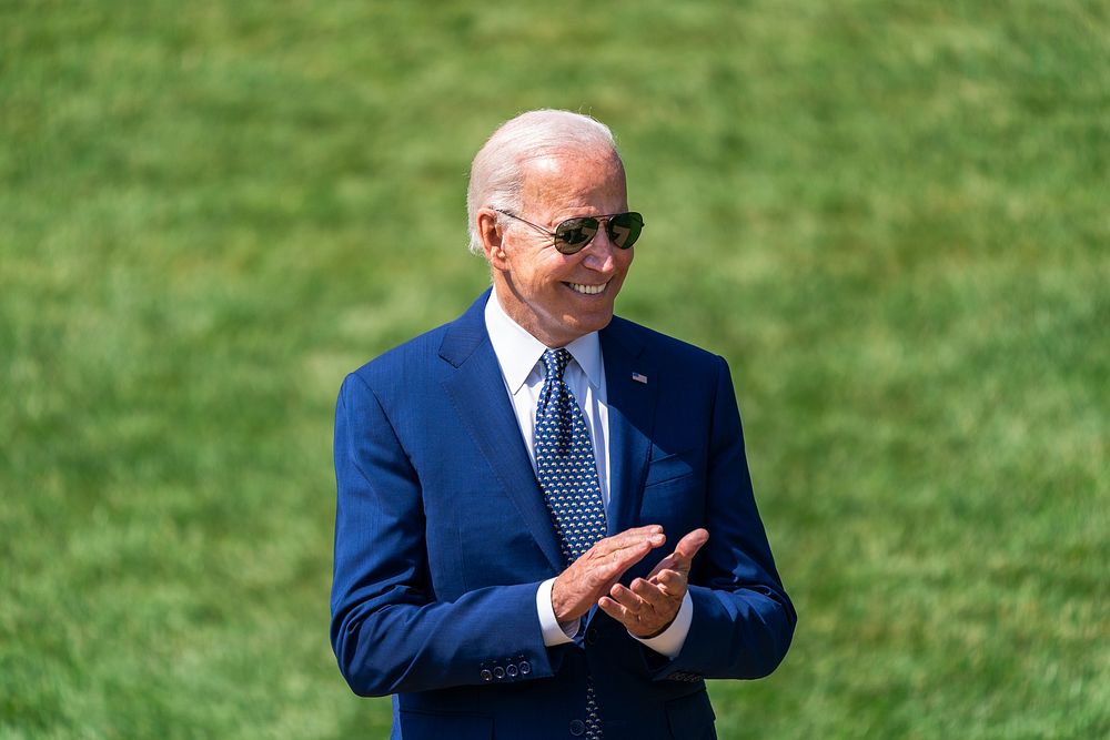 President Joe Biden claps during a clean car event Thursday, August 5, 2021 on the South Lawn of the White House. (Official…