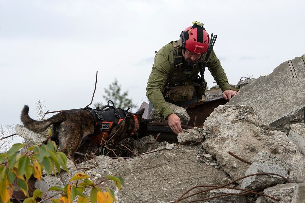 Kentucky Air National Guard Master Sgt. Rudy Parsons, a 123rd Special Tactics Squadron pararescueman, and Callie, his search…