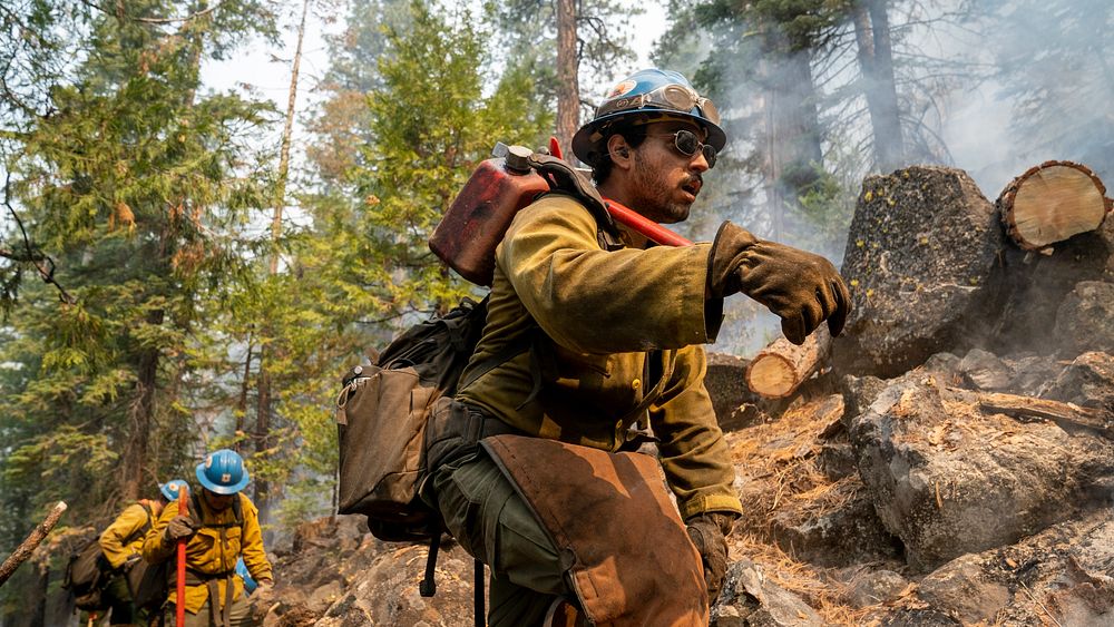Blue Ridge Hot Shots climb steep-sloped mountain to suppress the Dixie Fire in Lassen National Forest, California. USDA…
