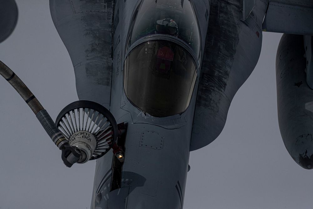 A U.S. Marine Corps F/A-18C Hornet with Marine Fighter Attack Squadron 115 "Silver Eagles" is refueled by a U.S. Air…