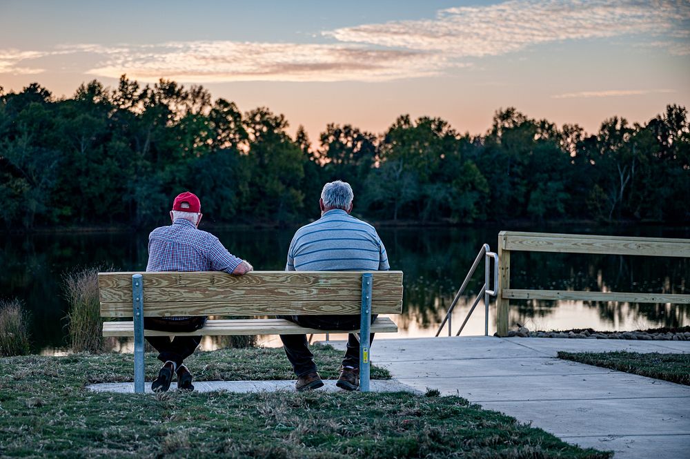 Men sitting by the lake