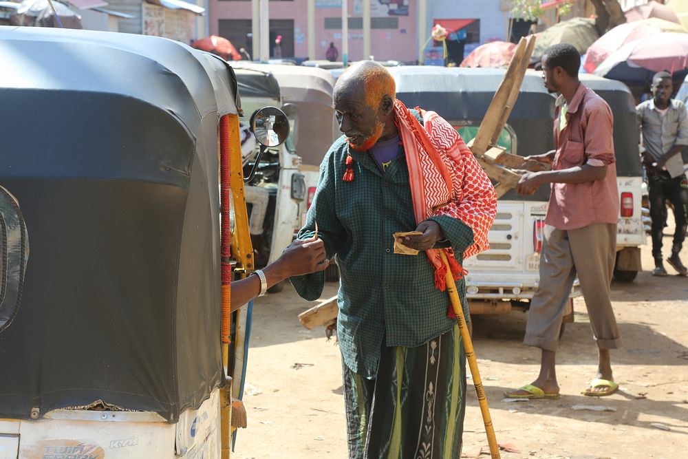 Old man on the street. Original public domain image from Flickr