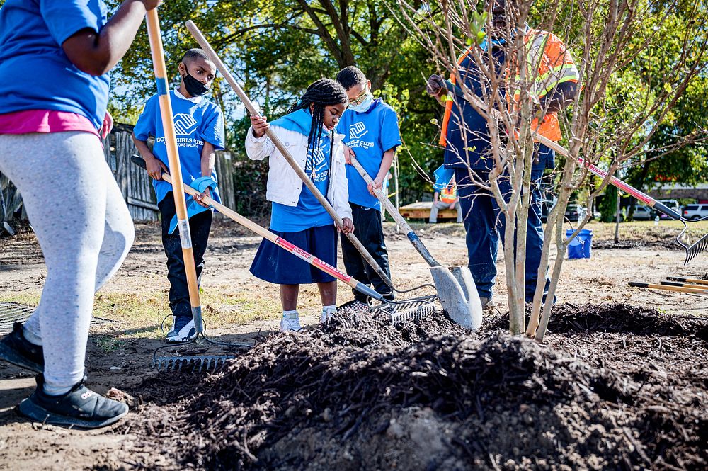 Children planting 43 trees during the annual Community Tree Day on Tuesday, October 26. Original public domain image from…