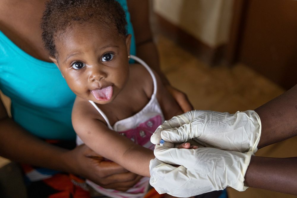 A baby is given a malaria diagnostic test. Original public domain image from Flickr