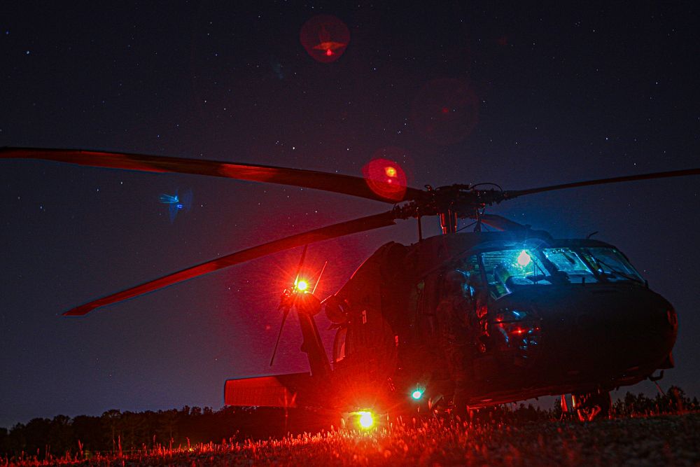 An UH-60L Black Hawk aircrew assigned to Alpha Co., 3-10 GSAB, equipped with the Volcano landmine system, gets ready to take…