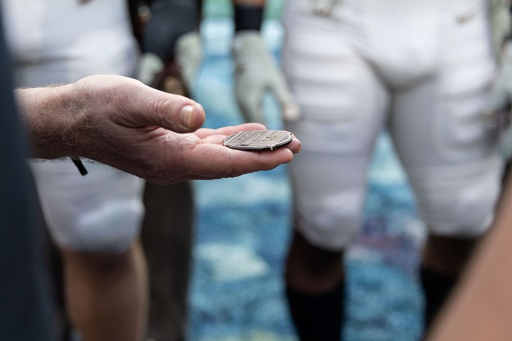 Coin toss before the Army-Navy football game. Original public domain image from Flickr