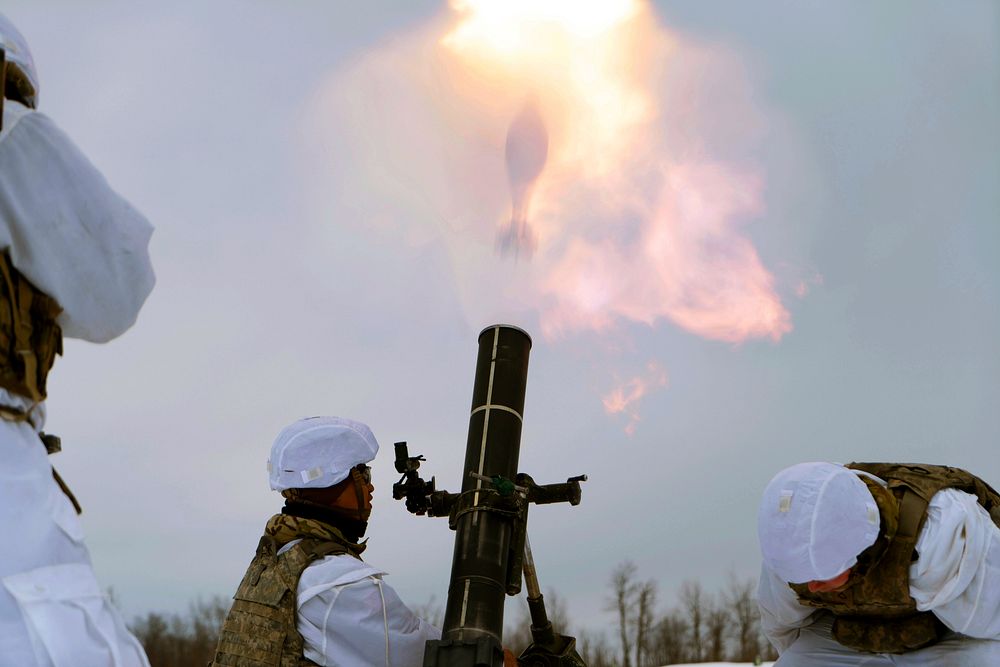 Soldiers shooting a mortar. Original public domain image from Flickr