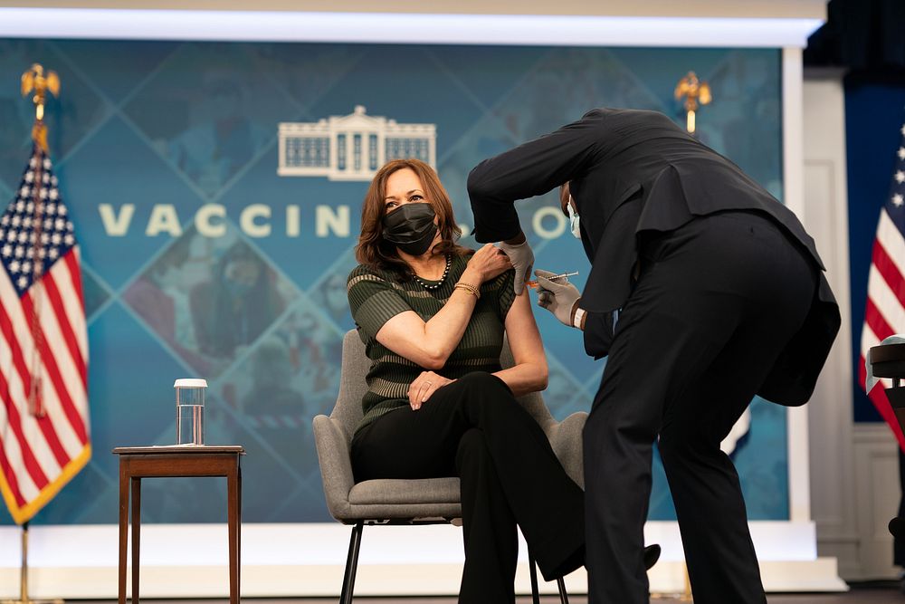 Vice President Kamala Harris receives her Moderna COVID-19 vaccine booster shot in the South Court Auditorium of the…