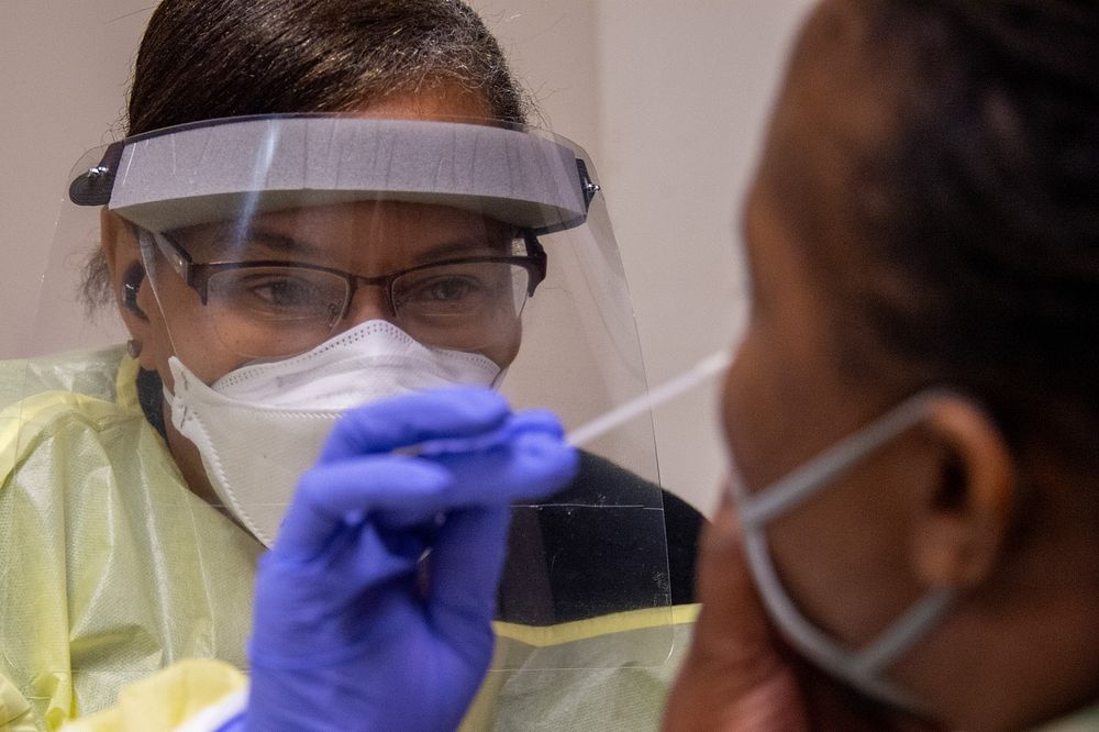 COVID Testing220102-N-YS140-002Fort Pickett, Va. (Jan. 02, 2022) Bobbie Toliver from Rhino Medical Services conducts COVID…