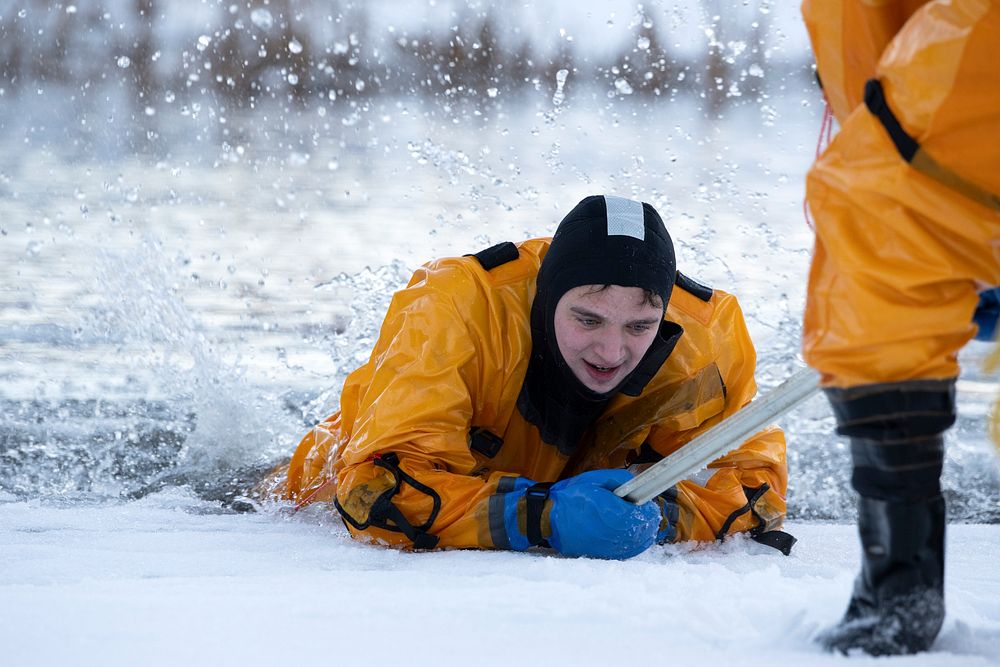 JBER fire protection specialists conduct ice rescue training. Original public domain image from Flickr