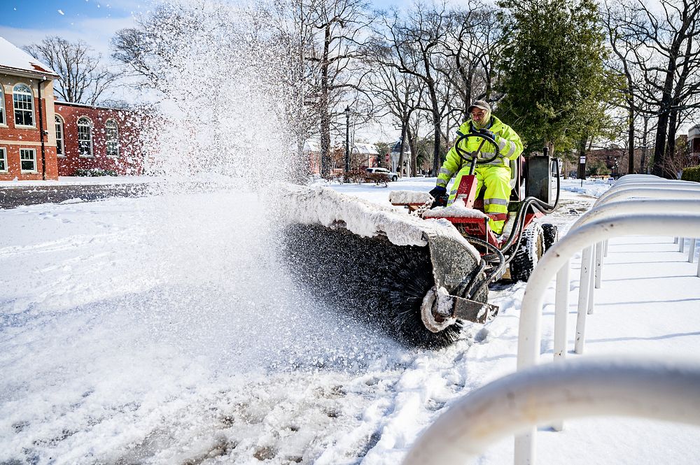 ECU staff work to clear sidewalks across campus on Saturday, January 22, 2022. Original public domain image from Flickr