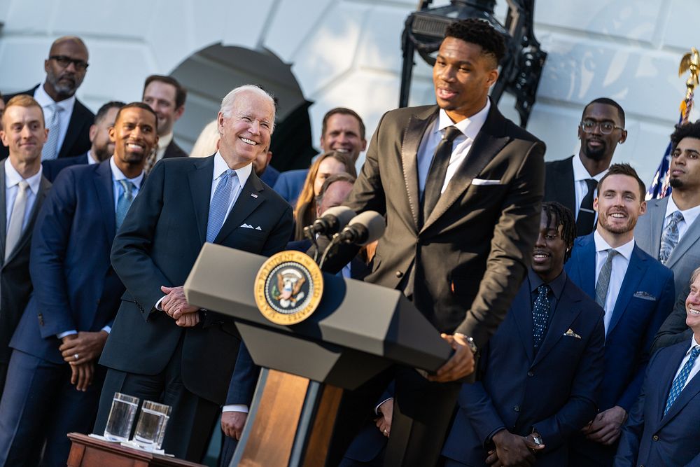 President Joe Biden looks on as player Giannis Antetokounmpo makes remarks during an event with the 2021 NBA Champion…