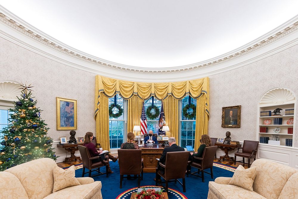 President Joe Biden meets with White House staff in the Oval Office, Tuesday, November 30, 2021, to review remarks he will…