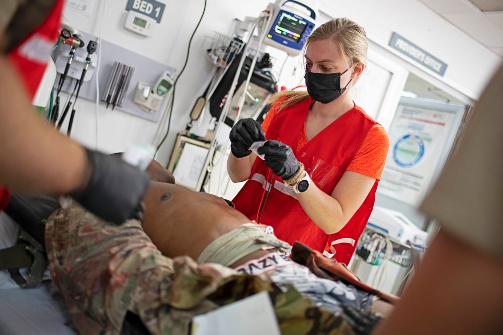 CAMP LEMONNIER, Djibouti (Jan. 26, 2022) U.S. service members attached to Michaud Expeditionary Medical Facility treat a…