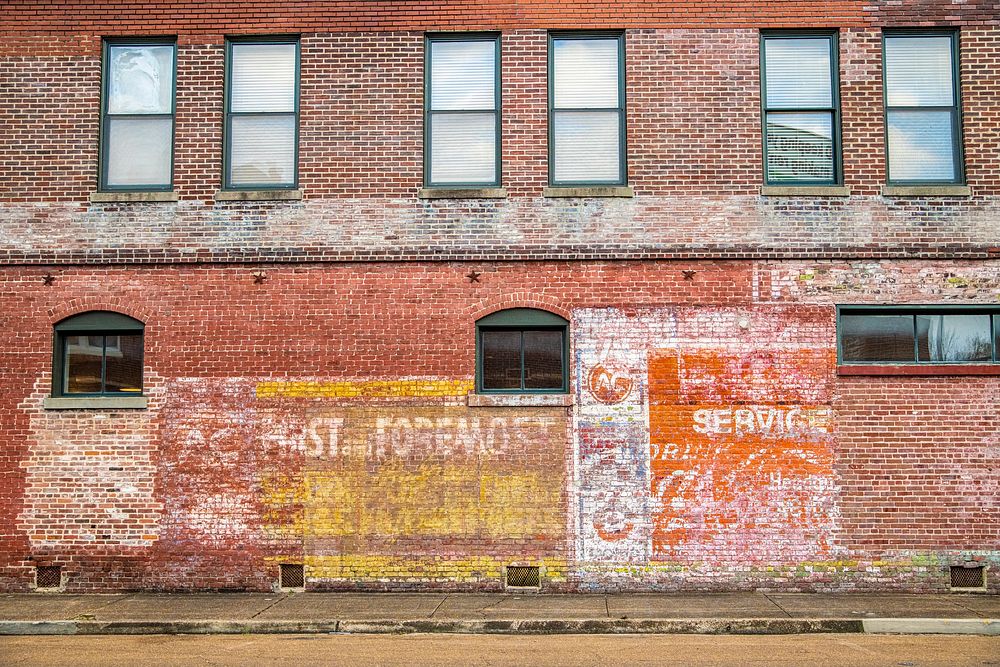 Faded wall signage in Central Historic District and Railroad Historic District of Greenwood, MS, on January 28, 2022. USDA…