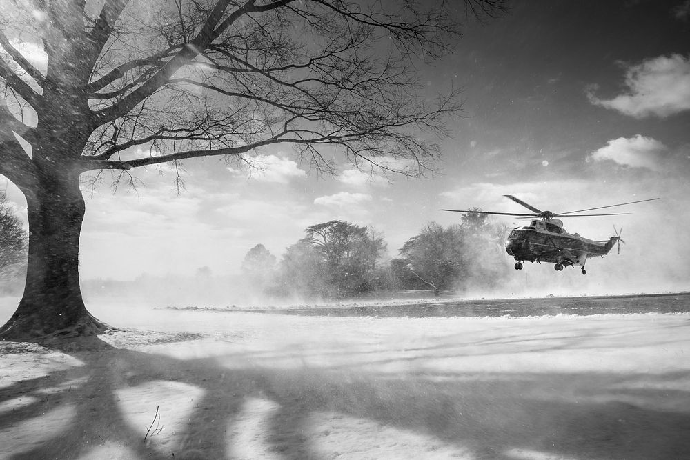 The wash of Marine One kicks up snow Friday, January 7, 2022, as it lands on the South Lawn of the White House. (Official…