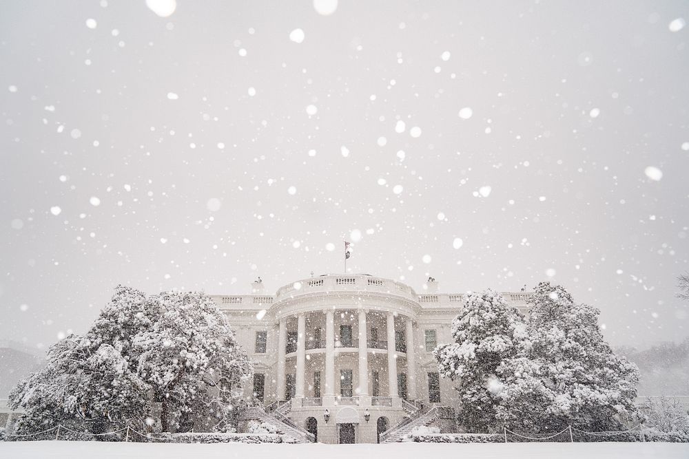 Snow falls at the White House.