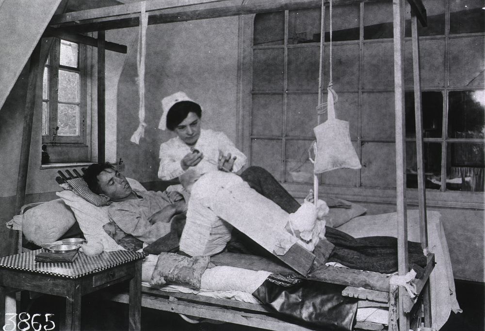 U.S. American National Red Cross Hospital No. 109, Évreaux, France: Nurse using Carroll-Dankin solution on patients wound -…