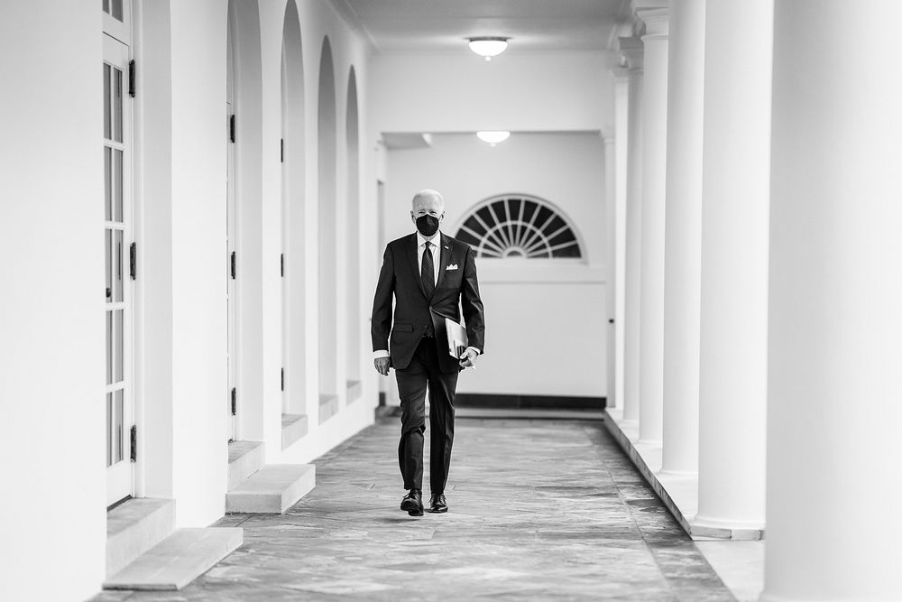 President Joe Biden walks along the West Colonnade of the White House, Thursday, January 20, 2022, on his way to the Oval…