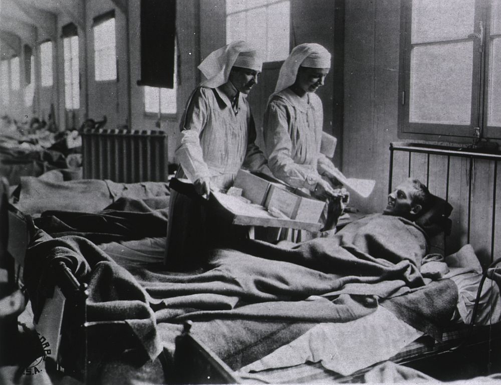 U.S. American National Red Cross Evacuation Hospital No. 114, Fleury-sur-Aisne, France: Ward M, nurses cheering up the…